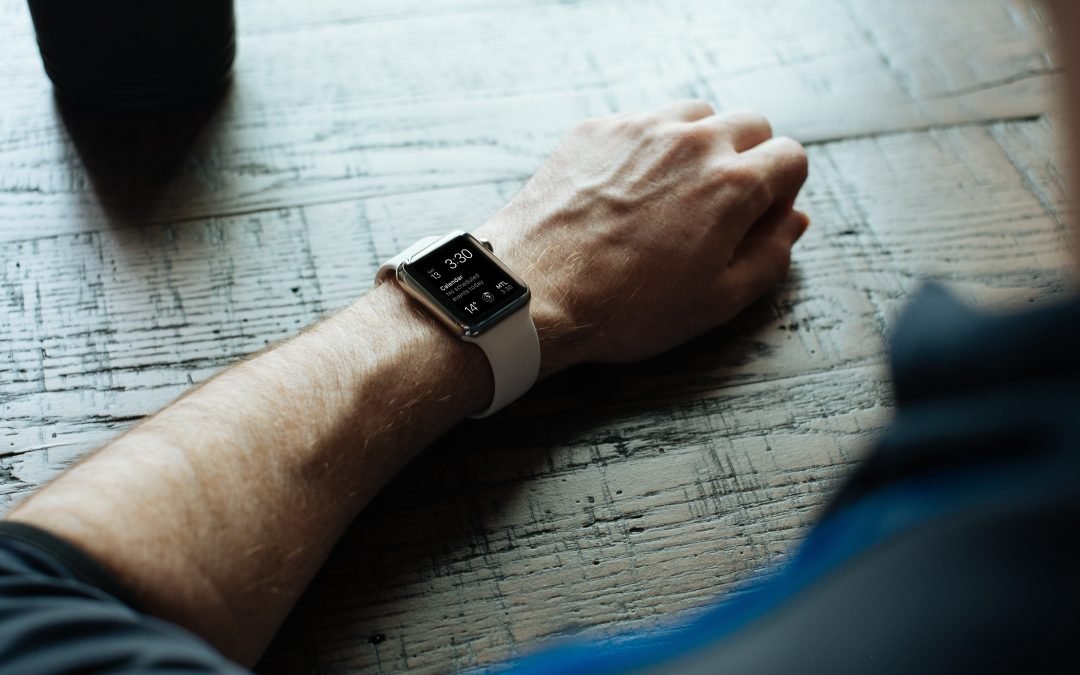 man-looking-at-smartwatch