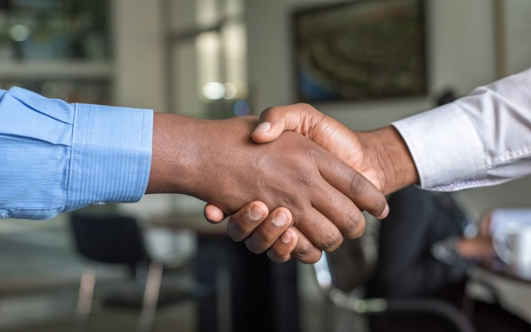 two businesspeople shaking hands